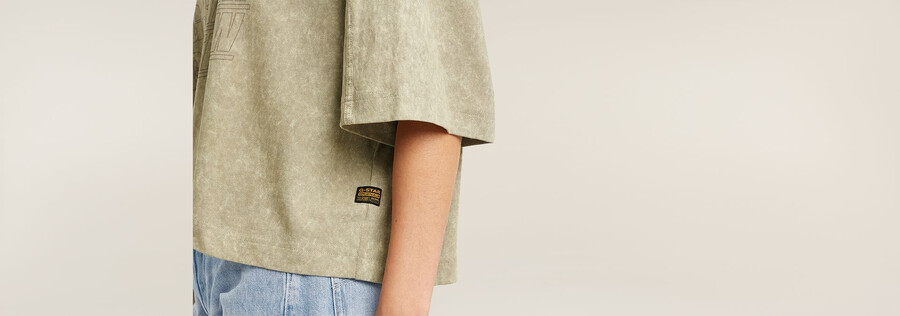 verwaschenes oversized-t-shirt mit mehreren logos
