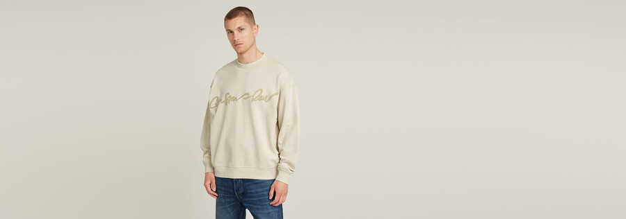 lockerer chenille-pullover mit g-schrift