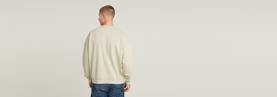 lockerer chenille-pullover mit g-schrift