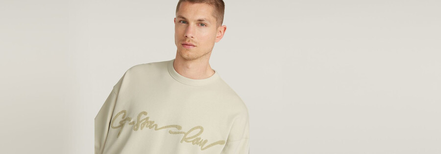 lockerer chenille-pullover mit g-schrift