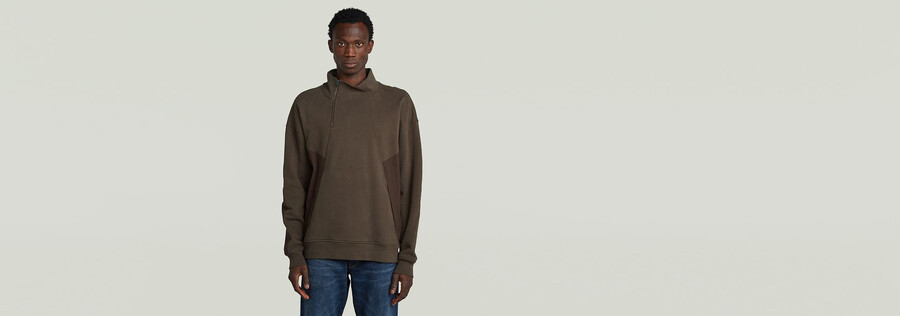 pullover mit halbem reißverschluss aus einem materialmix