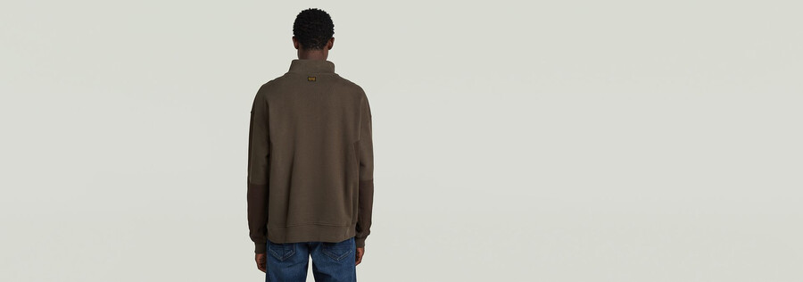 pullover mit halbem reißverschluss aus einem materialmix