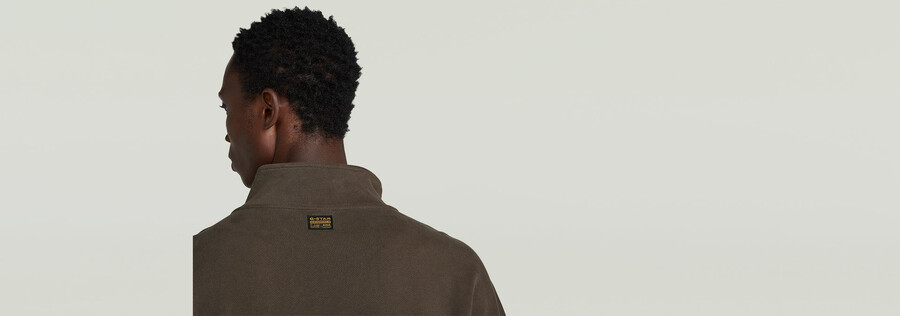 pullover mit halbem reißverschluss aus einem materialmix