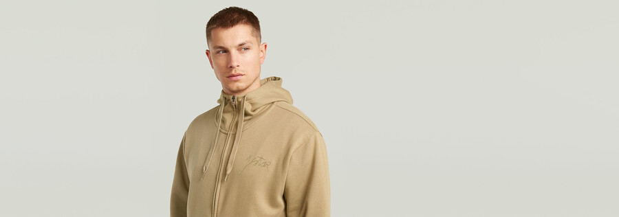 kapuzenpullover mit schriftzug und reißverschluss